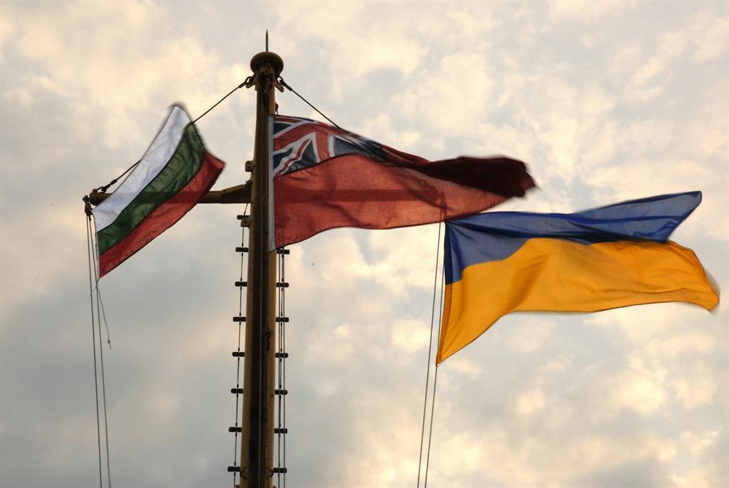 Ukrainian and Bulgarian flags over the river Thames